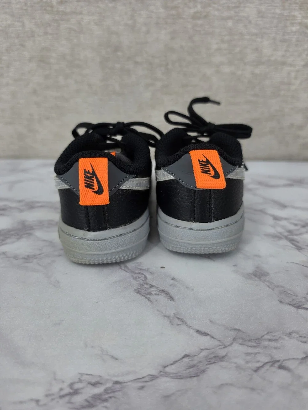 Nike Air Force Lv8 Kids Black & Gray Low-Top Sneakers with Orange Accent